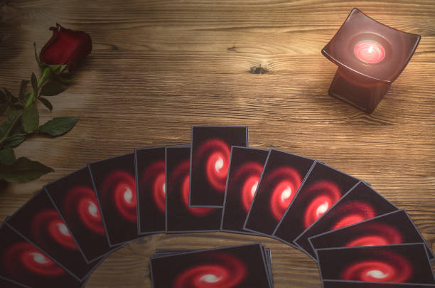 istock Tarot cards on wooden table background with copy space. Fortune teller. Future reading concept. 930765482