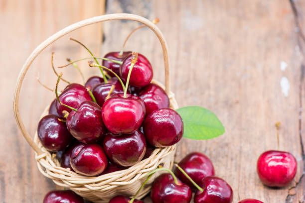 istock Fresh Cherry from farm, sweet and sour fruit, wooden table background 930768512