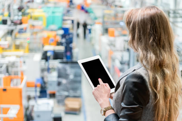 istock Female manager working on tablet in factory 930768814