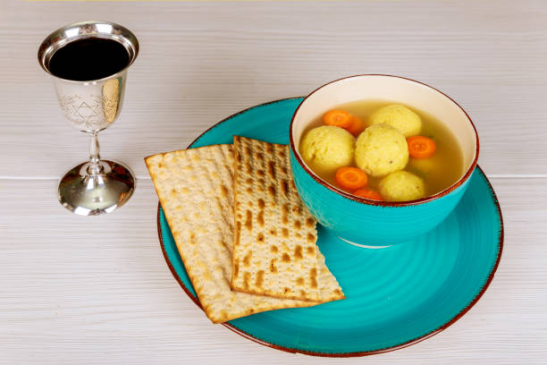 istock Delicious Matzoh ball soup with Pesach Passover symbols 930771992