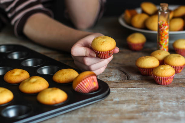 istock muffins (cupcakes) - fresh pastries on a wooden surface. copy space 930776568