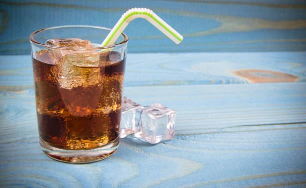 istock Sweet, fizzy drink with ice on a blue background. 930776950