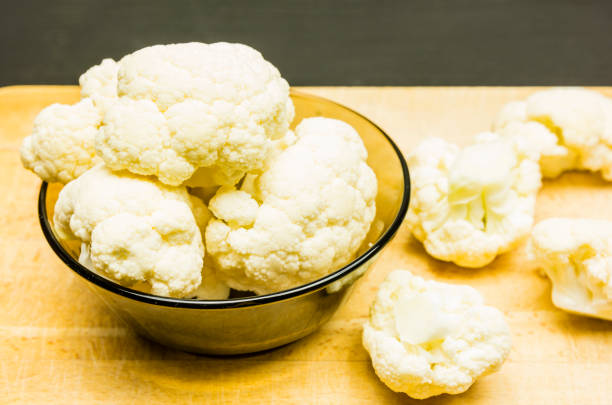 istock Cauliflower in a bowl on a wooden background. 930787802