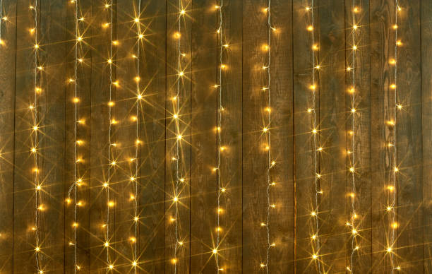 istock dark wood background with lights, abstract holiday backdrop, copy space for text 930789578