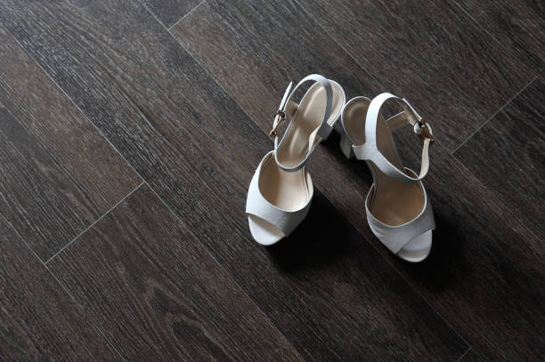 Women's 1930s style shoes disgarded under a bed