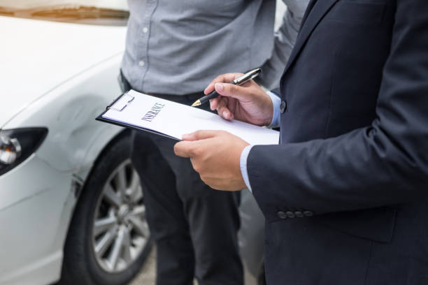 istock Midsection Of Salesman With Customer Standing By Car 930809772