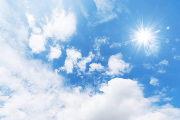 istock Blue sky background with the sun,Blue sky with white clouds floating in the sky. 930824416