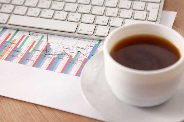 istock office working desk top view with laptop, notepad and coffee 930827420