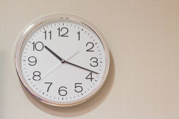 istock silver and white steel clock on wall concept : late morning, sleeping, morning 930835884