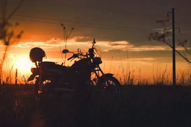 Silhouette of a motorcycle on the road