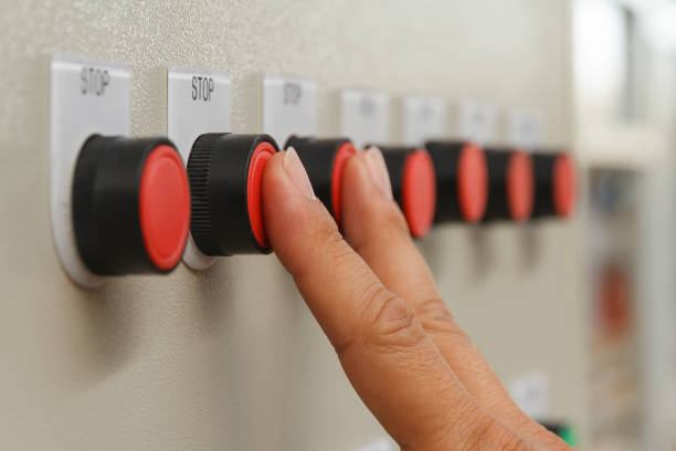 istock Forefinger and middle finger touch on red stop buttons. 930845454