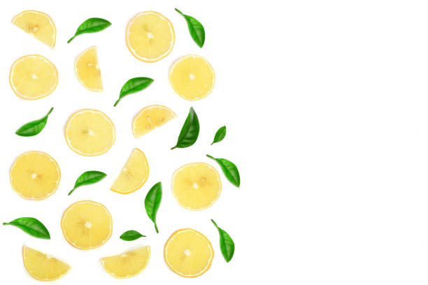 istock lemon with leaves and slices isolated on white background with copy space for your text. Flat lay, top view 930848544