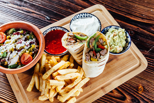 Mexican Burrito Meal With fried fries, salad and sauce