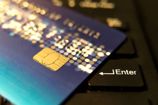 istock closeup credit card on black enter button, convenience shopping concept 930851914