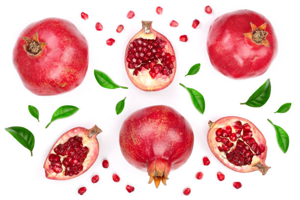 istock pomegranate with leaves isolated on white background. Top view. Flat lay pattern 930852060