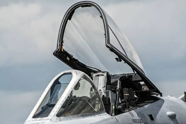Military fighter jet cockpit canopy close up.