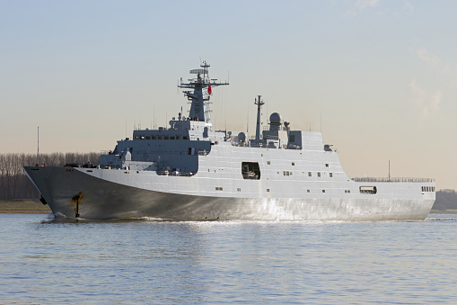 Chinese military naval amphibious transport ship leaving port.