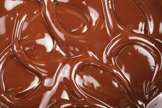 istock Melted chocolate swirl as a background closeup 930861538