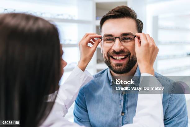 Doctor And Patient In Ophthalmology Clinic Stock Photo - Download Image Now - Optometrist, Optometry, Eyeglasses