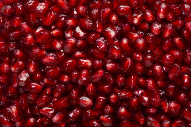 istock Background with seeds of fresh pomegranate fruit 930867900