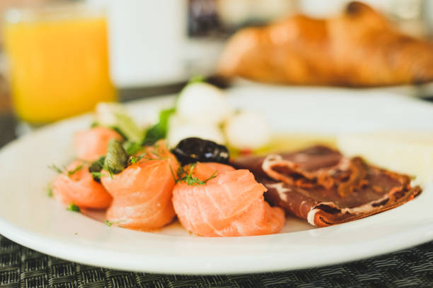 istock Plate with salmon, pastrami, cheese and olives 930868068