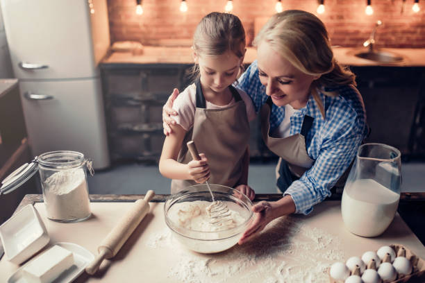 istock Grandmother and granddaughter cooking on kitchen 930868272