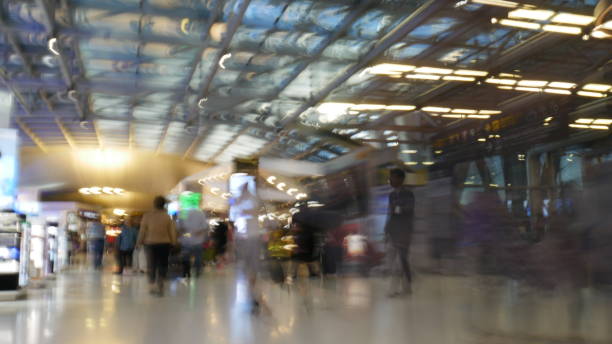 istock Defocused of people walking at Airport 930868308