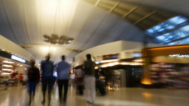 istock Defocused of people walking at Airport 930869080