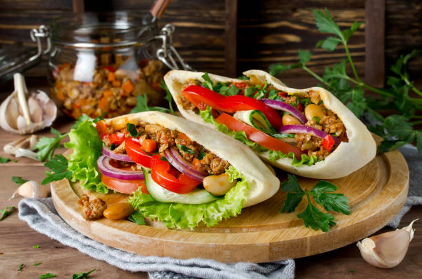 istock Pita bread sandwiches with meat, beans and vegetables 930869254