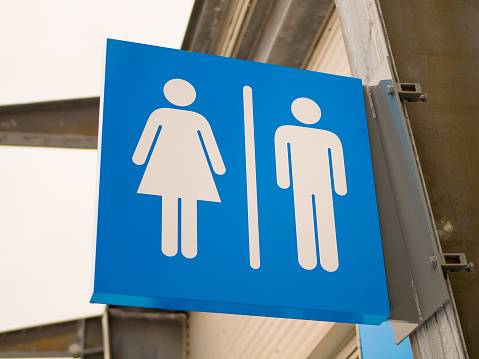 Outdoor blue toilets sign