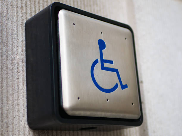 push to open button for disabled - physical impairment wheelchair disabled accessibility imagens e fotografias de stock