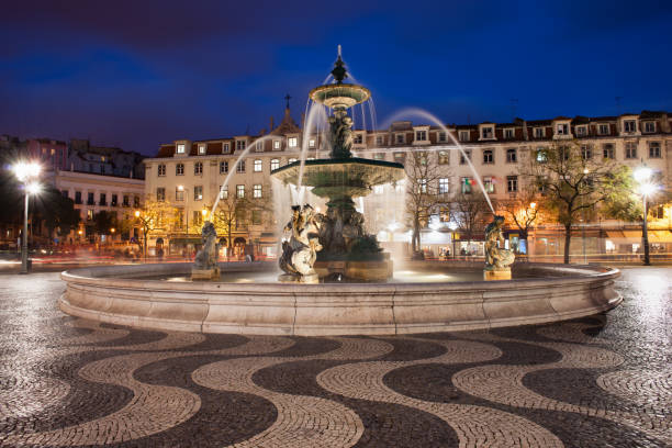 Fountain on Rossio Square at night in Lisbon, Portugal.