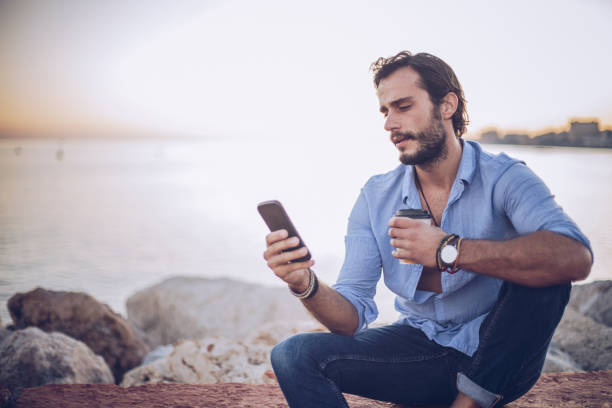 istock Man relaxing by the sea 930872566