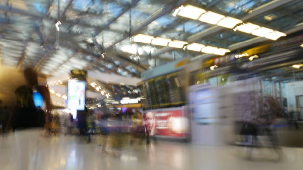 istock Defocused of people walking at Airport 930874882
