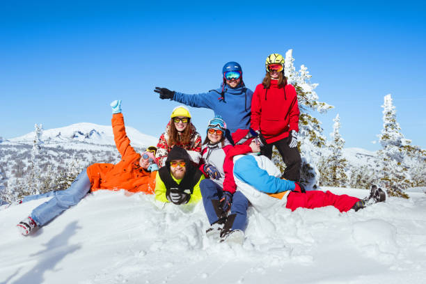 istock Winter holidays at ski resort. Friends are having fun 930876306
