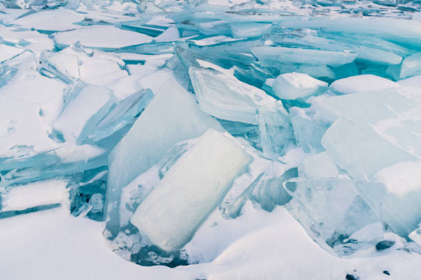 istock Full of cracks freezing water surface, Baikal Russia 930881928