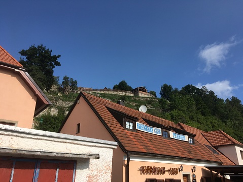 Cesky Krumlov, Czech Republic - 21 August 2017: Exterior of Bluegrass Club hotel on top of a hill in the charming medieval town of Cesky Krumlov. Small budget hotel in Cesky Krumlov.