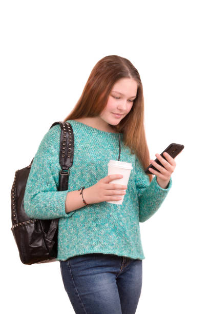 istock A girl communicates in a chat on a smartphone and drinks coffee 930884624