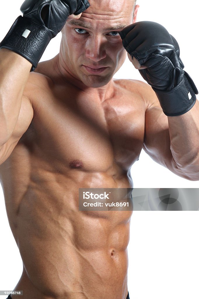 Ultimate fighter portrait Ultimate fighter in front of white background Adult Stock Photo