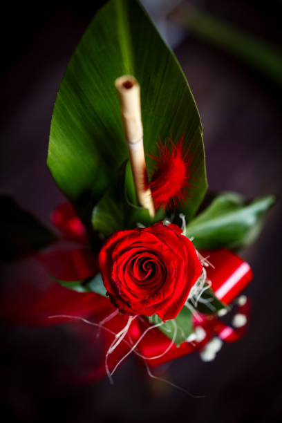 istock beautiful romantic red rose on wood table background 930896734