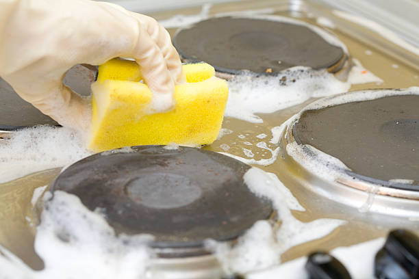 hand cleaning dirty kitchen stock photo