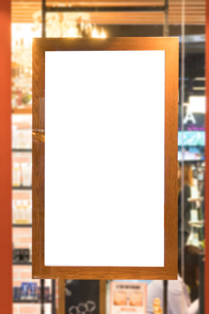 istock empty wood frame poster display on glass window at shop store front 930904480