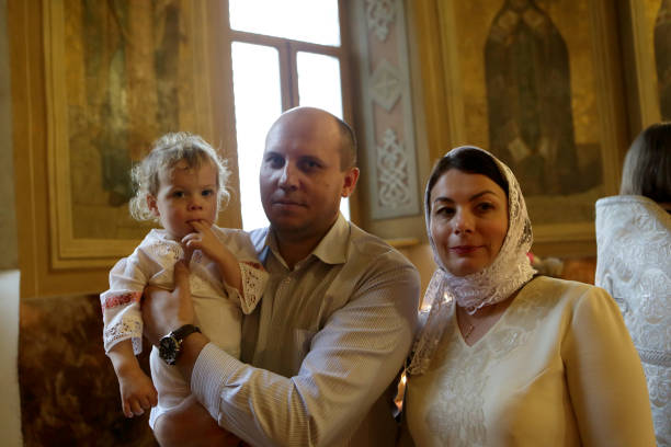 istock Parents with son in church 930904736