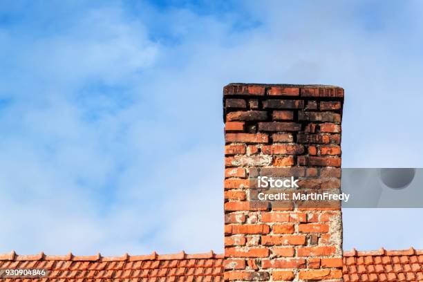 Old Brick Chimney Chimney With Sky In The Background Ecofriendly Heating Of A Family House Stock Photo - Download Image Now