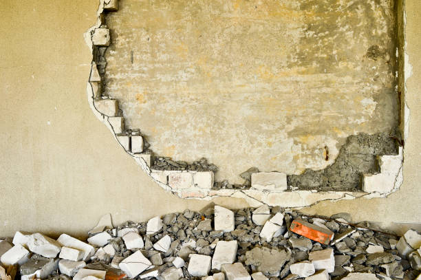istock Partially destroyed wall inside an industrial building under demolition 930905044