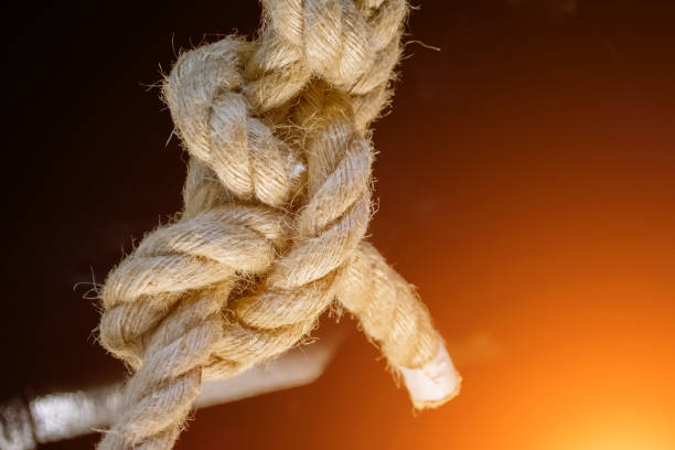 istock Sea knot is a thick rope, on a black background. 930905314