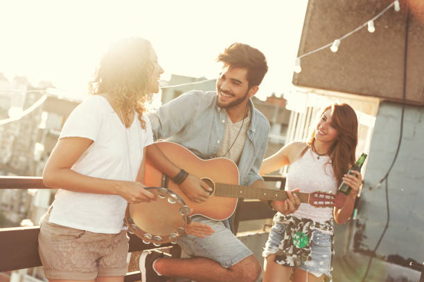 istock Friends singing and playing the guitar 930910240