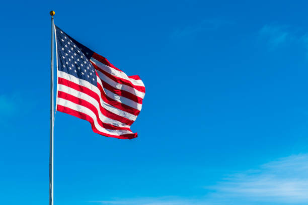 Perfect American Flag waving in the wind with shadows stock photo