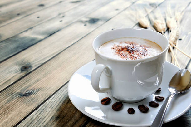 istock Traditional Italian breakfast with cappuccino on a rustic wooden table 930910954