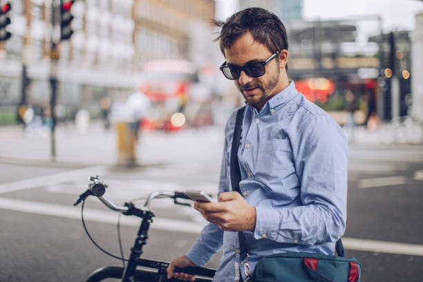 istock Man using mobile phone on the street 930915616